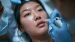 © BlackBridge Media - Asian Woman Receiving Lip Filler Injection at Aesthetic Clinic