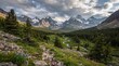 © smvect - Dramatic mountain landscape with a quaint village nestled in a lush green valley