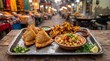 © Mehwish - Traditional Indian street food platter with samosas and pakoras, authentic spicy snacks on metal tray, rustic outdoor market setting