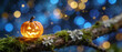 © Fahad - Glowing halloween pumpkin jack o lantern on mossy tree branch, magical autumn night background, spook illuminated lantern, festive seasonal decoration, fairytale enchanted forest lighting.
