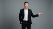 © MheeP - Successful young male entrepreneur in formal attire presenting an empty space.