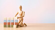 © Lashan - Marketing team KPI tracking and business growth building concept with wooden mannequin stacking block bar chart with copy space for performance review presentation banner