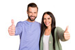 © deagreez - Photo of optimistic couple show thumb up wear sweater isolated on beige color background