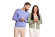 © deagreez - Photo of young happy smiling cheerful couple using smartphones man peeks to woman phone isolated on beige color background