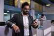 © Pix4Ads - Indian successful businessman using his smartphone to send a text message. man holding smartphone, typing message, successful investor happy with investment project.