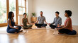 © hadi - Diverse group of people meditating in a circle on wooden floor