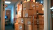 © The Little Hut - Stack of cardboard shipping boxes on a moving cart in a hallway, ready for delivery
