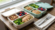 © Upang - Two divided meal prep containers with healthy balanced lunch.