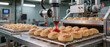 © javu - Smart food technology automates filling bread with red jam in bakery setting