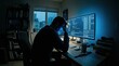 © sati - Programmer Silhouette Working at Multi Monitor Desk in Dark Night Office