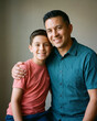 © Rendara Studio - Warm father and son posing together in warm studio portrait with warm natural light