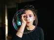 © Leo Rohmann - Bubble Portrait of a Woman Creating a Playful Soap Sphere
