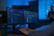 © ultramansk - A close view of a blue monitoring dashboard on a widescreen monitor reveals coloured status badges shifting across a cloud control panel in a modern technology company