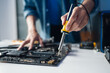 © Charlie's - IT Engineer Installing Computer Hardware Equipment and Maintaining Motherboard Components in Professional Electronic Repair Facility.