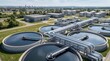 © CuteBee - Aerial view of modern industrial water treatment plant with large circular sedimentation tanks and complex pipeline systems for urban wastewater purification and environmental conservation