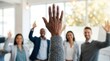 © Wannaeka - A professional business meeting featuring audience engagement through raised hands.