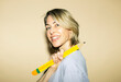 © VISTA by Westend61 - Smiling woman holds a giant paper pencil during brainstorming