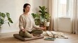 © Alva - Young woman practicing meditation and mindfulness in a bright cozy living room at home.