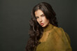 © millaf (Nemchinova) - Glamorous brunette woman with long healthy hair on dark background