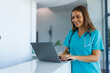 © Fly Frames - Medical professional using laptop for healthcare management