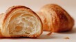 © Margarita Vais  - Macro shot of sliced croissant showing airy honeycomb internal texture on neutral studio background. Great for professional baking course website header, food packaging template or grocery store flyer