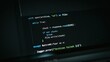 © Ranju - Python programming code displayed on a computer screen showing a file download script with error handling and logging functions in dark mode