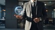 © MDSHAIM - A professional businessman holding a glowing digital sphere with the words trust us floating in his hand