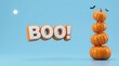 © Mst - A delightful halloween scene featuring a playful stack of pumpkins and a vibrant 'boo ' message perfect for seasonal greetings and festivities