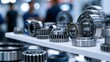 © Oleh - Metal ball and roller bearings with interlocking cogwheels showcased on a trade show shelf, highlighting precision engineering, shiny steel components and industrial machinery detail