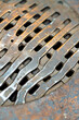 © Ева Поликарпова - Close-up view of a metal grate on a table. vertical frame
