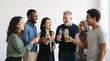 © Marin Studio - Diverse group of coworkers celebrating with champagne, toasting success together