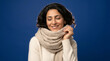 © Riverruno - Woman wearing a cozy cashmere scarf and sweater, smiling gently