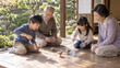 © CheeCatCreate - 縁側のある古民家で祖父母と孫が楽しそうに木製の独楽を回して遊ぶ心温まる家族の風景 generative ai