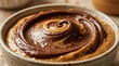 © verena - Creamy Peanut Butter Swirled with Chocolate in Bowl - Close Up