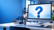 © Alamin - Computer monitor displaying a blue question mark on desk with notepad and office stationery.