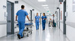 © simohamed - Medical staff and patient in bright hospital corridor, healthcare professionals in scrubs.