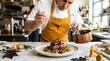 © Hasibul - Professional chef plating a gourmet steak dish with mushrooms and sauce in a highend restaurant kitchen
