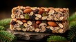 © Viktor - Two stacked granola bars packed with almonds, raisins, dried cranberries, oats and mushrooms. Healthy snack on dark stone with fir branches. Natural energy food.