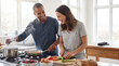 © Mahmud - Happy couple cooking together in a bright and airy kitchen at home