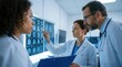 © Lamduan - In a clinic setting, a group of medical professionals is intently examining brain MRI scans on a lightbox.