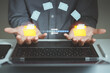 © MUNTHITA - Businessman using laptop to manage digital document with file transfer interface, data exchange, cloud storage, workflow automation, document management system concept for modern business technology.