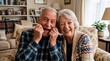 © Gabriel - Joyful elderly couple laughing and making funny faces at home