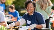 © AZ Studio - Smiling woman in wheelchair serving food at outdoor community event