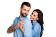 © deagreez - Love forever! Portrait of handsome casual candid joyful spouses isolated touching flirting looking at each other hands in blue denim outfit on silver background