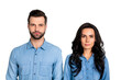 © deagreez - Close up portrait of two attractive fellows colleagues thinking about work problems questions listening attentively isolated in blue denim shirts over argent background