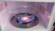 © YouraPechkin - A spiral galaxy is spinning inside a white microwave