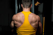 © Jale - fitness trainer doing exercise for back