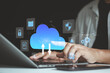 © MUNTHITA - Businessman using laptop with cloud file storage backup, Cloud based file storage and secure data backup solution with encrypted privacy protection. real-time synchronization, access file management.