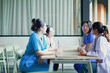 © ฺฺฺBoonterm - Group medical students and their peers are spending their free time relaxing having drinks and discussing medical academics table in a friendly and relaxed atmosphere at the medical university.