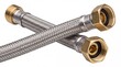 © Abdul - Flexible metal braided plumbing hoses with brass fittings connected in cross pattern on white background